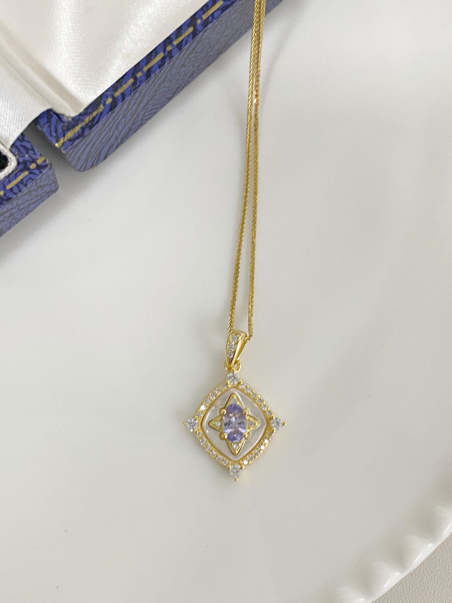 Tanzanite Pendant Necklace with Zircon Halo