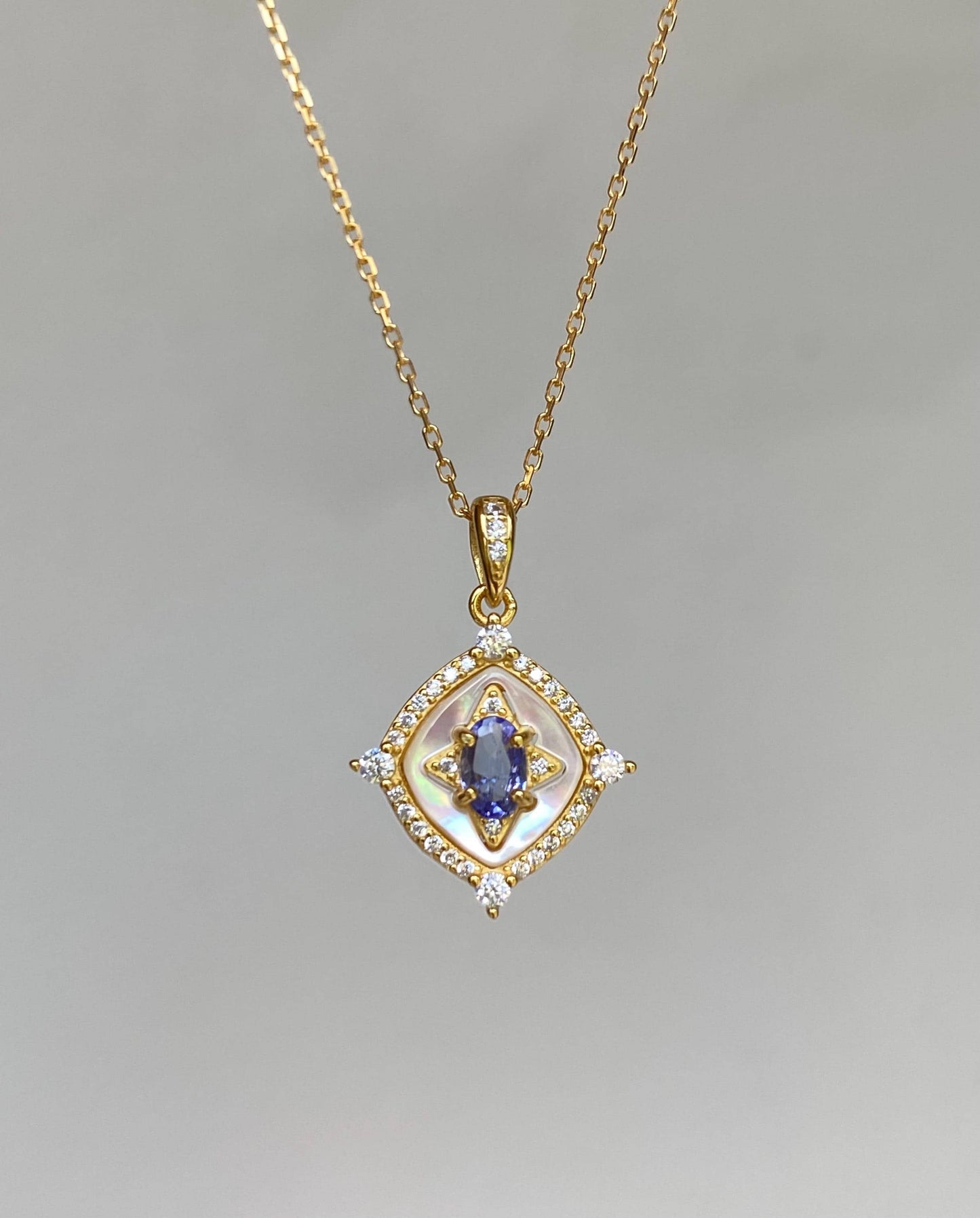 Tanzanite Pendant Necklace with Zircon Halo