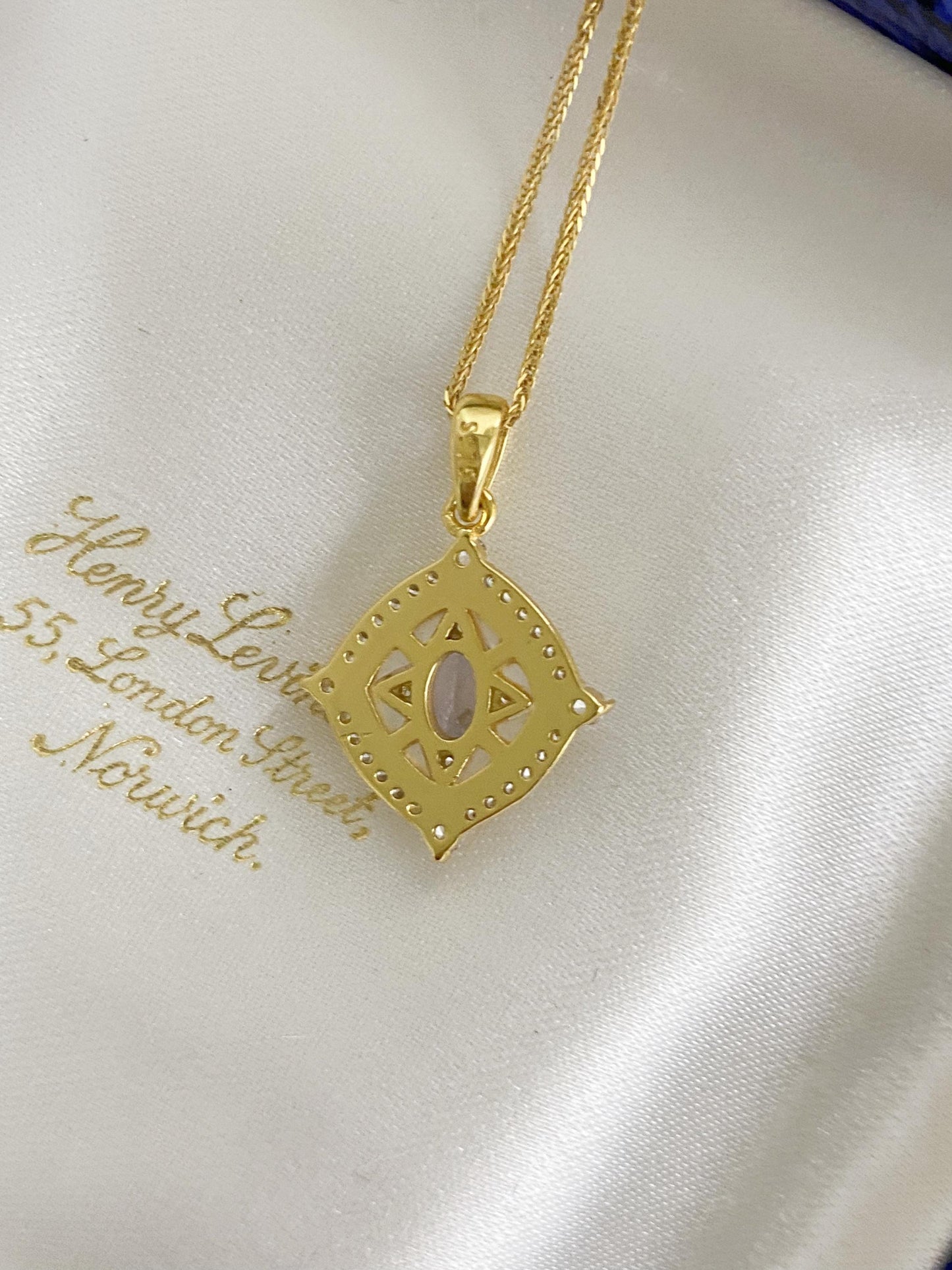 Tanzanite Pendant Necklace with Zircon Halo